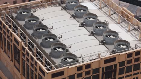 cooling tower fans spinning on a rooftop in dubai