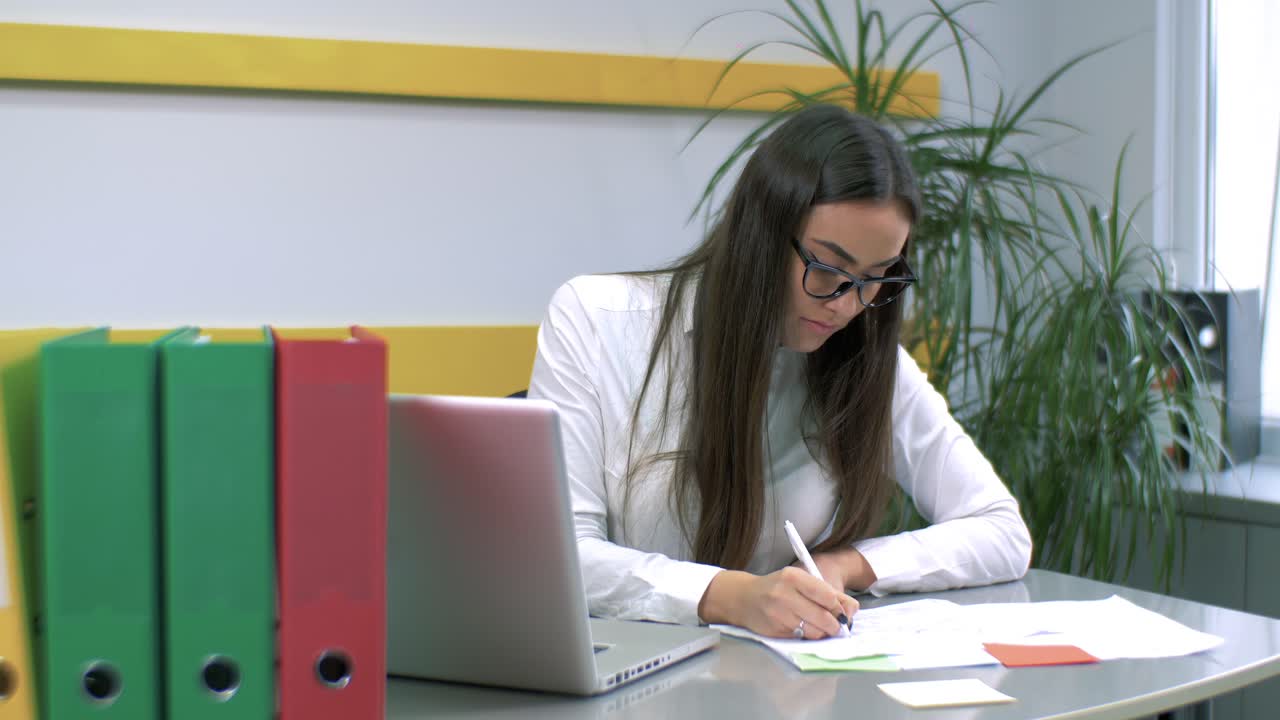 Businesswoman working at her desk in the office