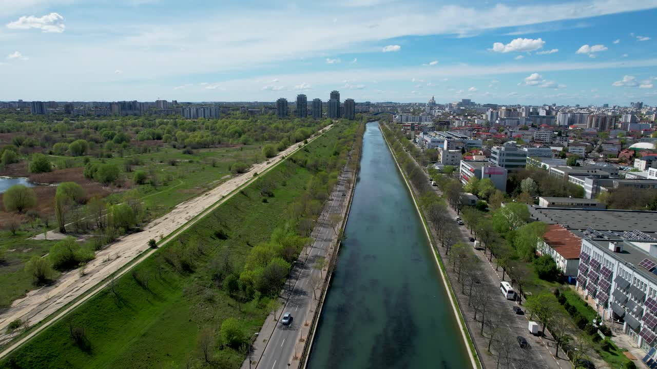 Captivating Bird's Eye View of Dambovita River, Vacaresti Delta, and Verdant Surroundings Against a Serene Blue Sky, Summer, Spring Bucharest, Romania