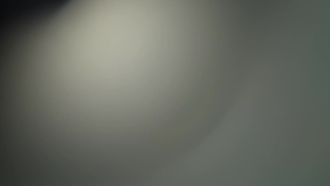 Abstract light leak on a black background. Slow motion.