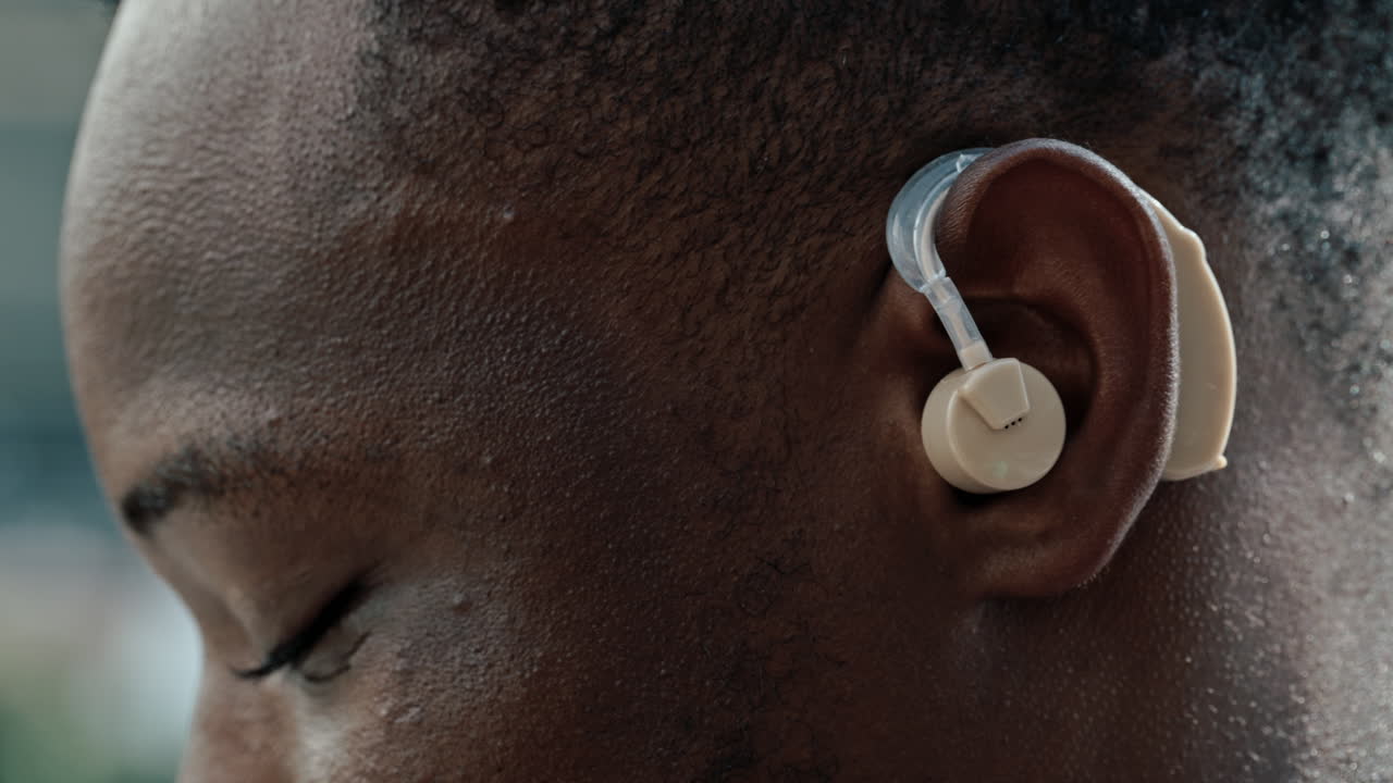 Close-up of a person wearing a hearing aid