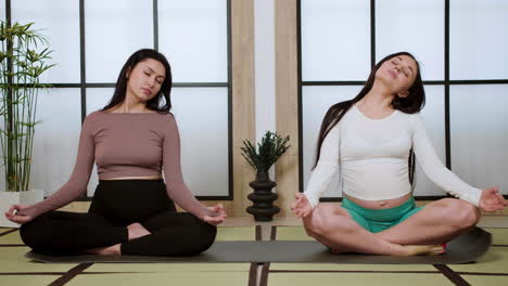 women doing yoga indoors