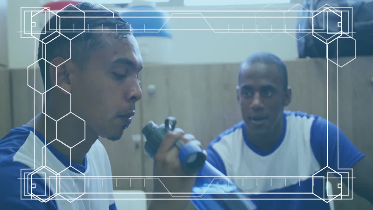 Animation of white frame with markers over football players during break in changing rooms