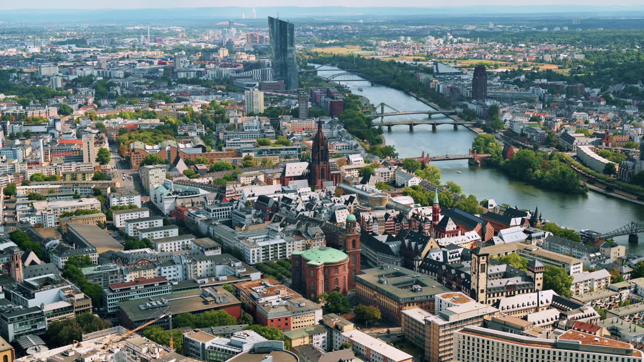 Panoramic view of Frankfurt from a skyscraper, Germany. Multiple residential and office buildings, skyscrapers, Cathedral, river Main