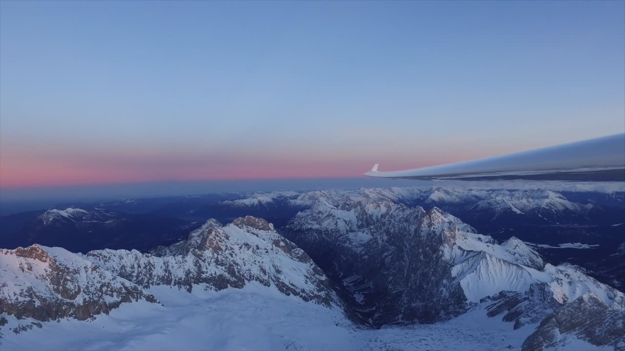 View from above the mountains flying with a glider over the Zugspitze.