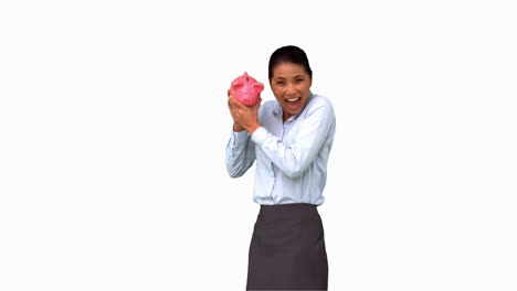 Businesswoman-shaking-a-full-piggy-bank-on-white-screen