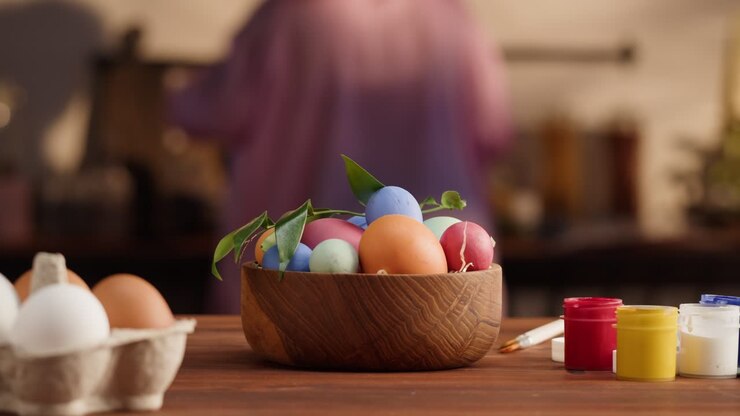 Happy Easter holiday. Colored eggs close-up. Preparing for Easter, painting and decorating eggs. Christian celebration, family traditions.