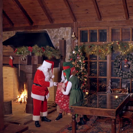 Elves filling up of Santa Claus sack