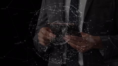 animation of globe of connections over caucasian businessman using tablet