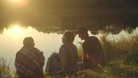 friendly conversation during rest on nature. girl sharing coffee with guy