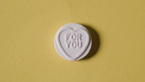 Heart-Candy-With-For-You-Message-On-Yellow-Background