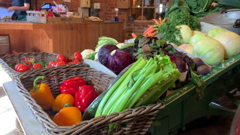 Fruit-and-vegetables-displayed-in-wicker-basket-in-a-rural-farm-shop