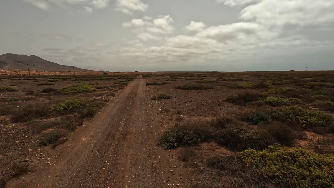 Driving off-road along desert volcanic landscape of Boa Vista island, Cape Verde. Car point of view