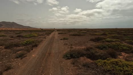 driving off-road along desert volcanic landscape of boa vista island, cape verde. car point of view