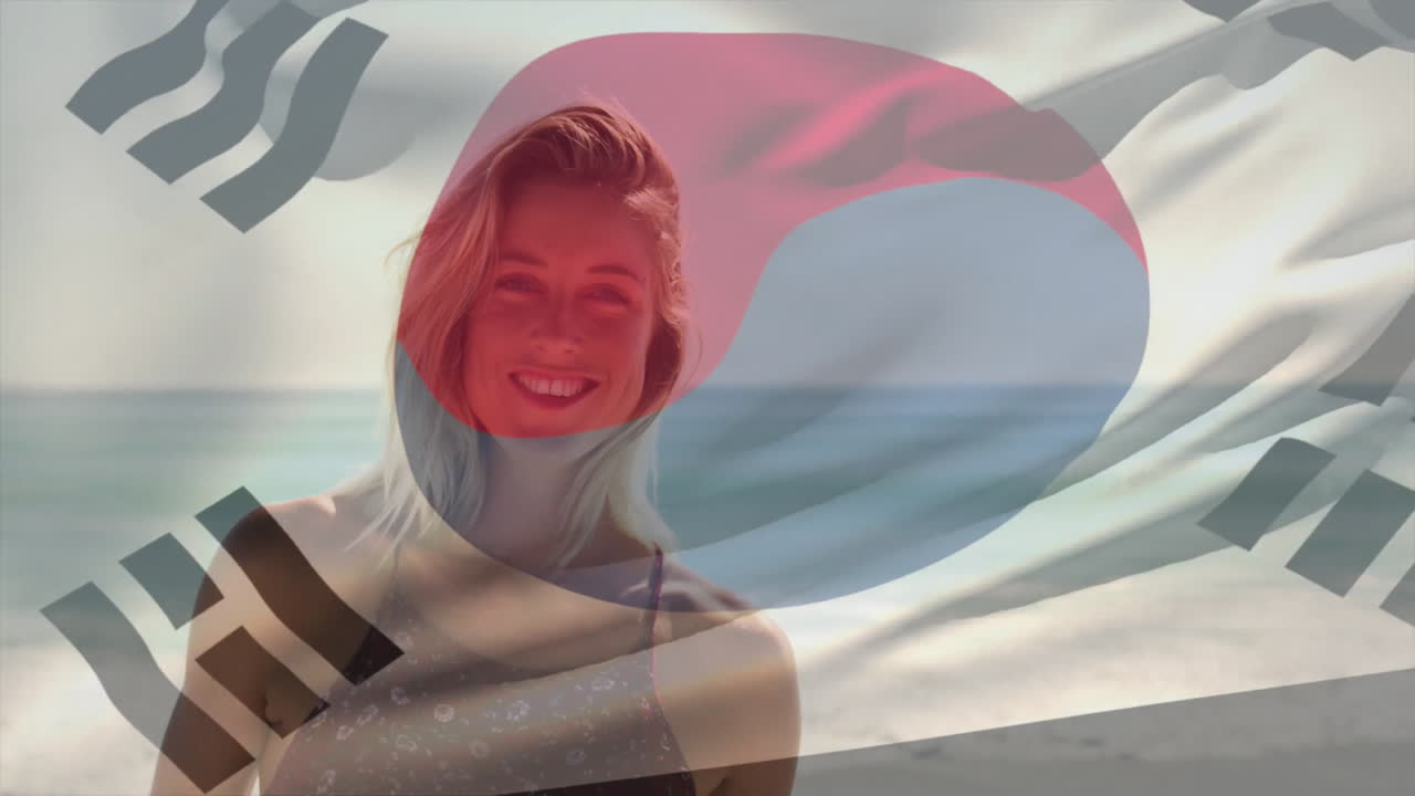 At beach, woman smiling with South Korean flag animation overlay on photo