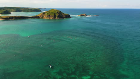 Aerial-over-one-of-the-many-bays-on-Kuta,-Lombok-Island,-Indonesia