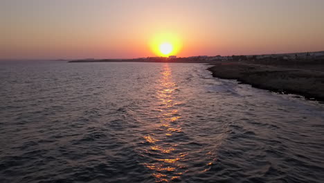 aerial shot of a cloudless sunset of the sea coast at a holiday resort