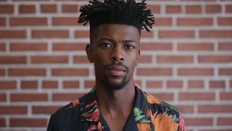 portrait attractive african american man looking serious calm independent black male funky hairstyle fashion slow motion