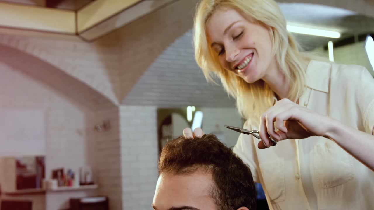 Man getting his hair trimmed with scissor