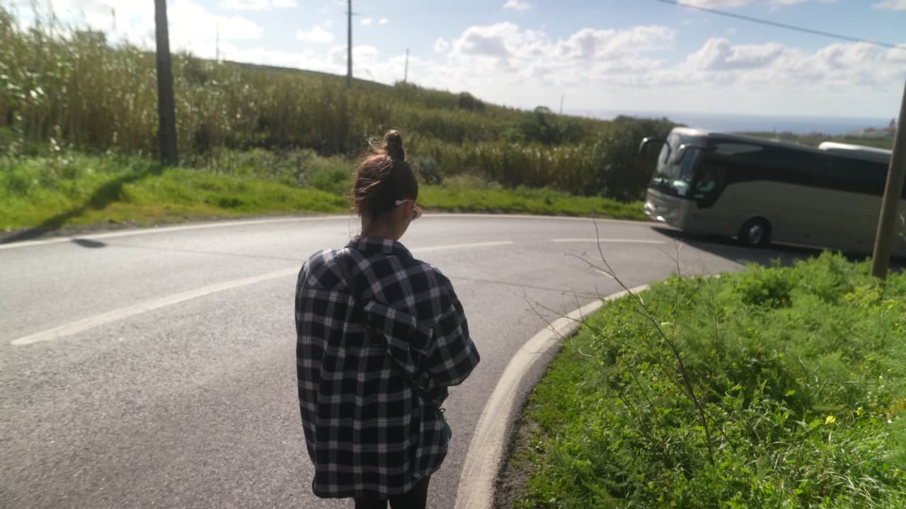 Woman Walking on a Scenic Country Road