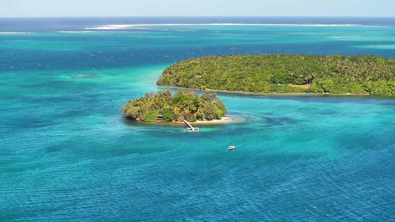 Crystal clear waters and lush green islands in South Pacific. Vava'u Island group, Tonga. Drone view