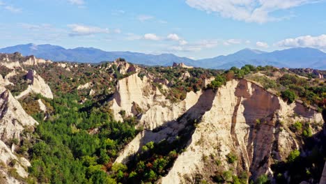 aerial push shot to melnik sand rock formation pirin mountain landscape