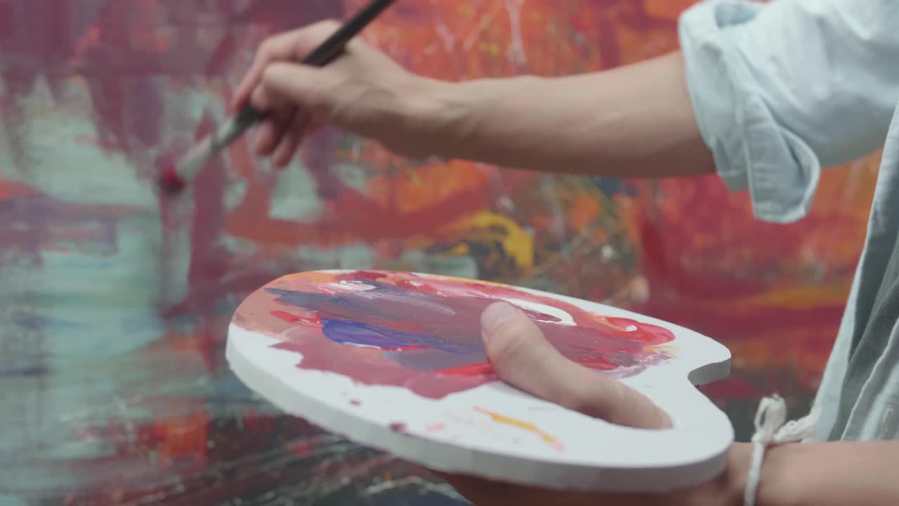 Hand Holding Paint Brush And Painting Art