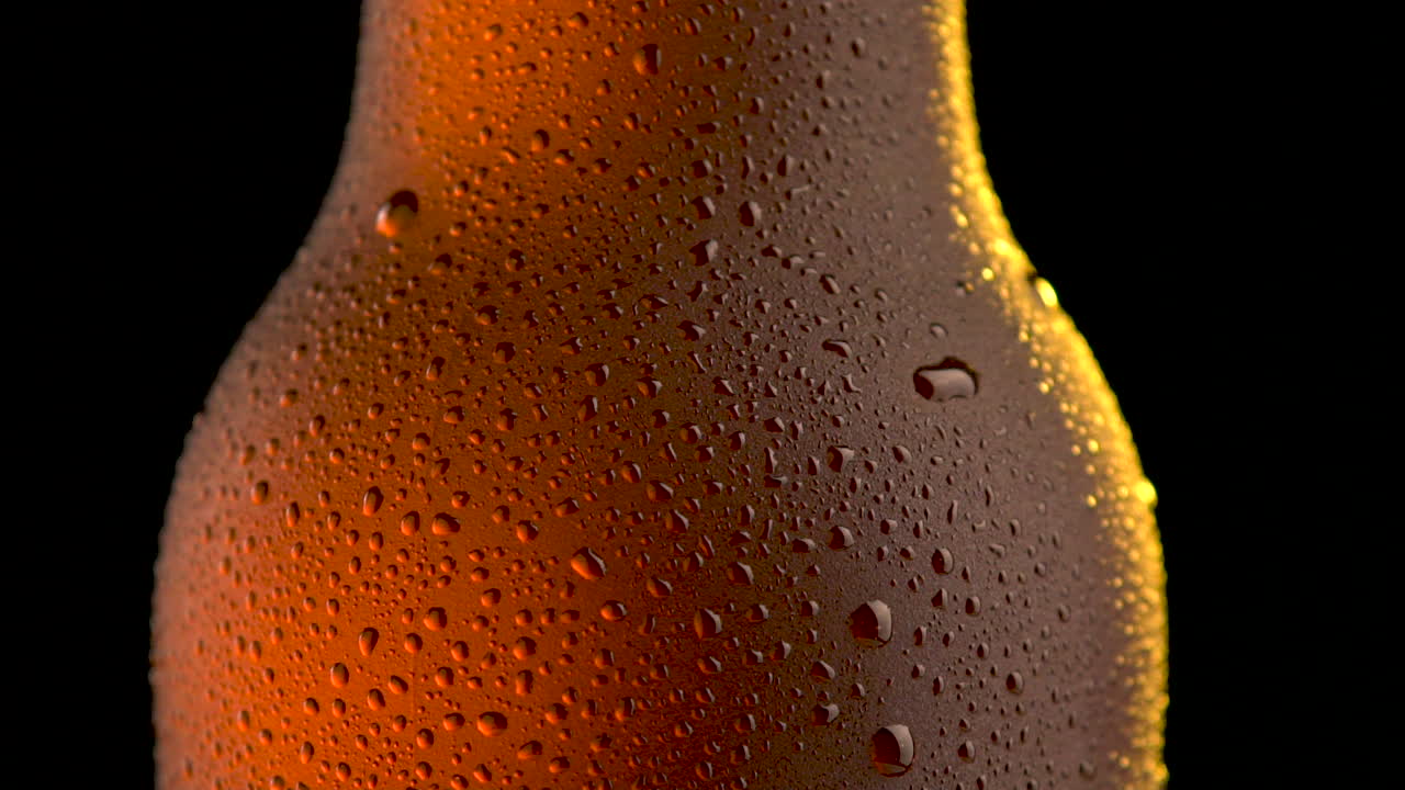 beer bottle rotating on black background