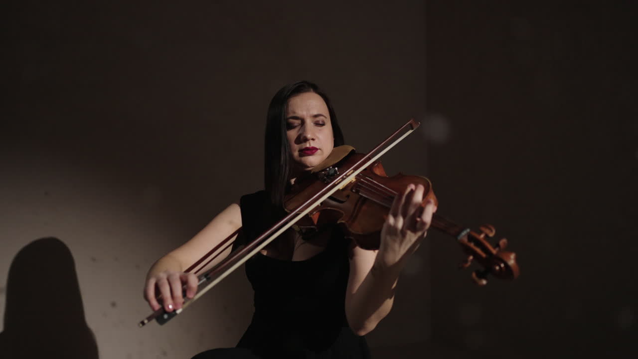 Violinist Playing in a Studio Setting