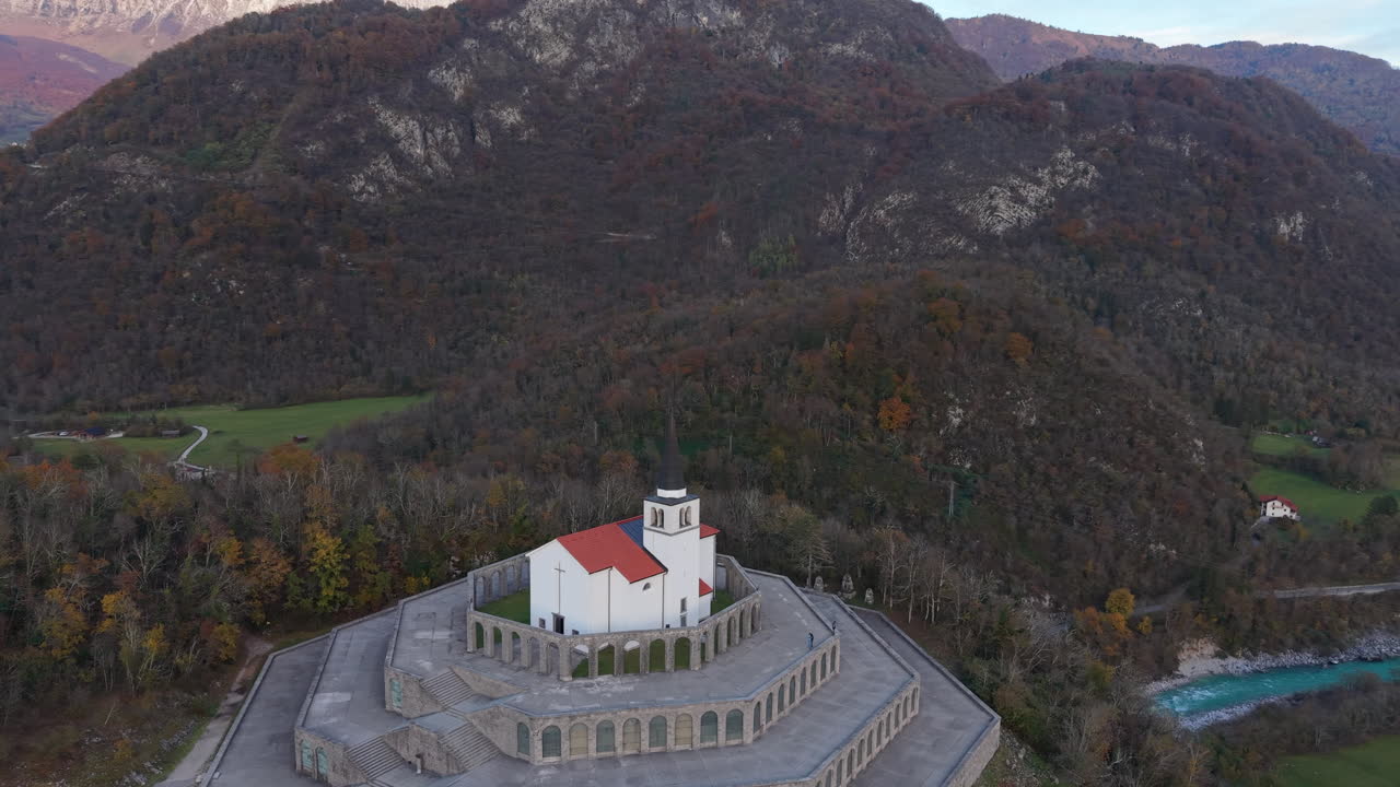 Aerial view of the St. Anton Church and World War I Memorial near the Soca river in Slovenia