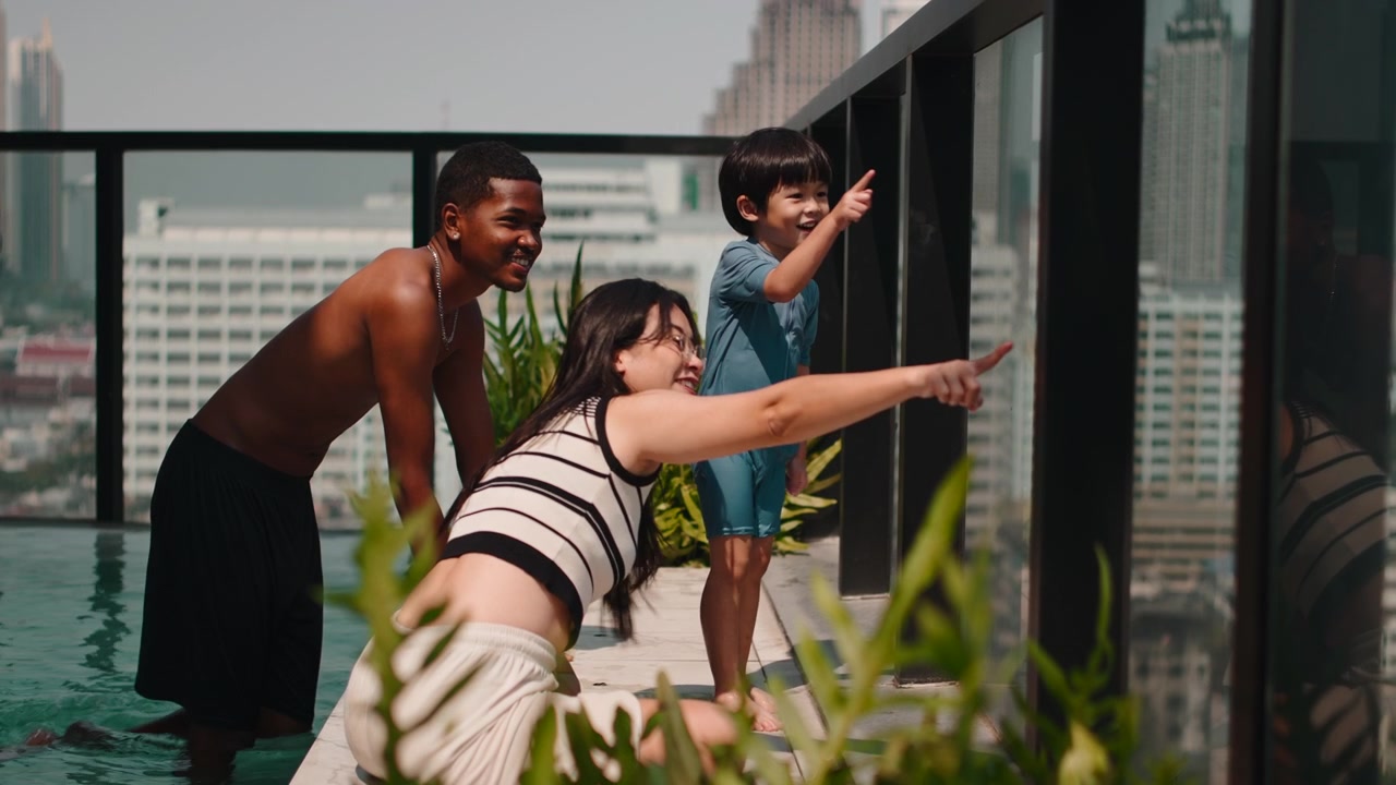 Diverse Family Enjoying Time at Rooftop Swimming Pool