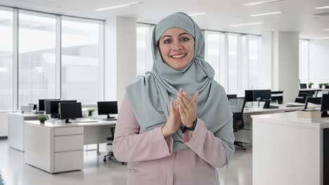 happy muslim businesswoman clapping and appreciating