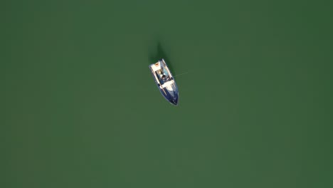 Woman-on-the-boat-catches-a-fish-on-spinning-in-Norway.