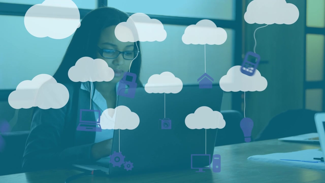 Animation of graphical clouds and computer icons over businesswoman working over laptop