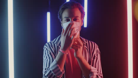 man wearing a mask in neon light