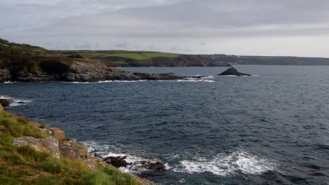 wide shot of bessy's cove,the enys headland with praa sands in the background