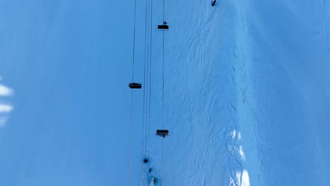 ski lift seat and snowing mountain