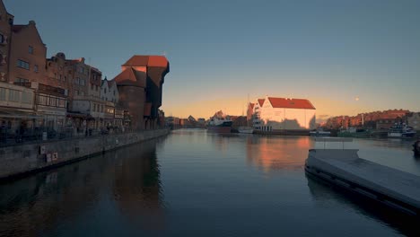 panning shot of gdansk's city by the river motlawa river