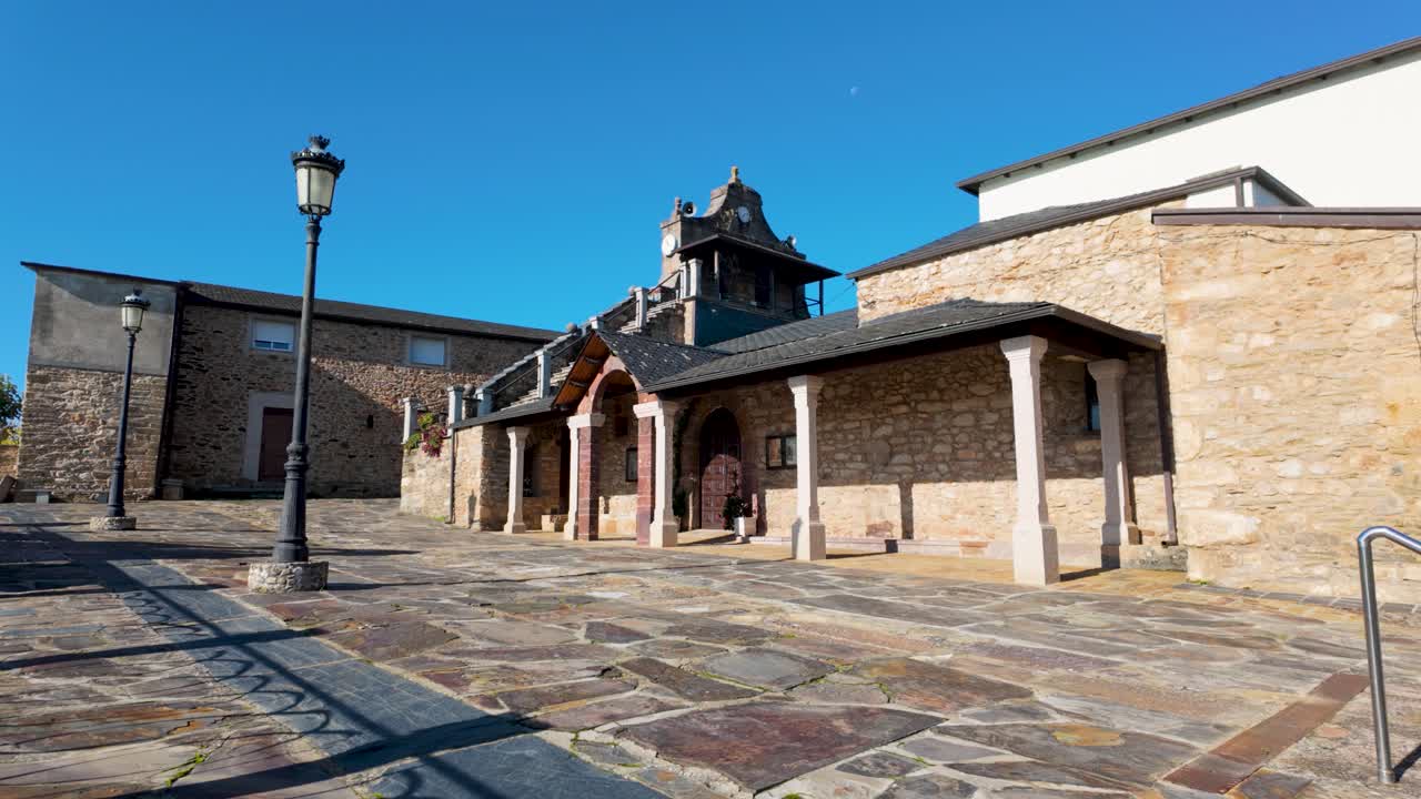 Church of Santa Mariña de Rubiá, showing exterior walls, roof structure, and stone foundation in Galicia