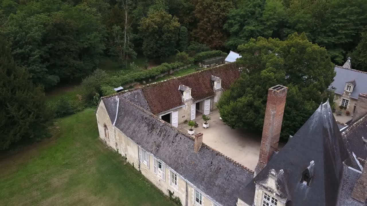 Historic slate roofs, chimneys and inner courtyard of the Chateau de Villesavin in the Loire Valley, France