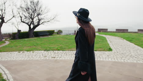 elegant woman walking around the small italian town