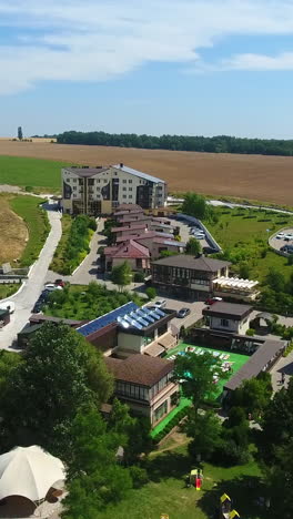 nice and beautiful rural spa resort for comfortable rest and recreation. well-kept green zone with pools, ponds and tennis courts. drone footage. vertical video