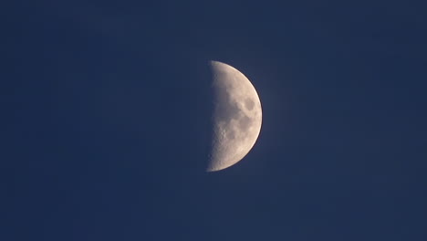 First-quarter-moon-time-lapse-in-night-sky----4K