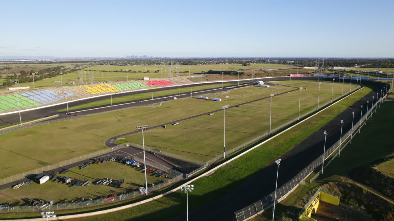 Aerial flyover Calder Park Thunderdome, sunny day Victoria, Australia