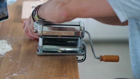 4k slow motion experience: close-up of unrecognizable man's tagliatelle making journey