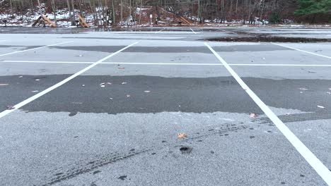 drone landing in a frosty cold parking lot in late december