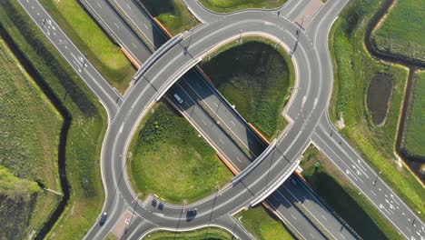 aerial top view of the motorway. interchange between the motorway and the city. the exit of the motorway the view from the drone