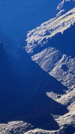 close up aerial view of rocky mountain cliffs