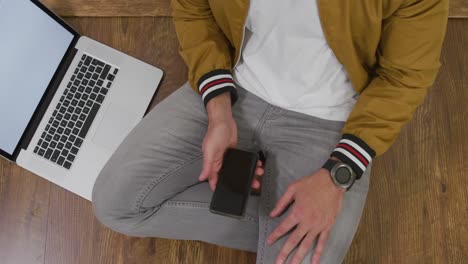 caucasian man using his phone