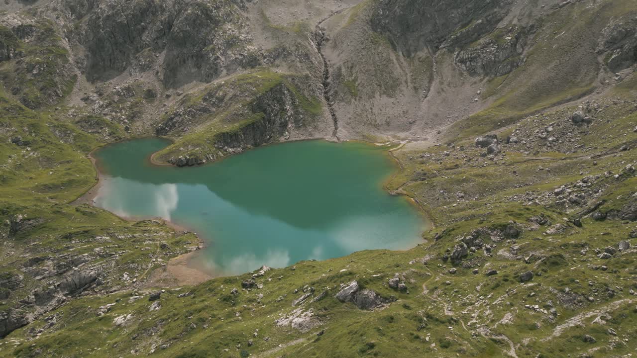 Scenic aerial view of a tranquil mountain lake in Gramais, peaceful setting